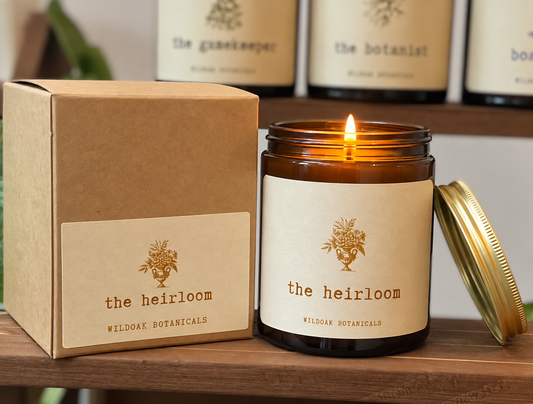 WILDOAK BOTANICALS The Heirloom soy candle with oud, rose, saffron, and patchouli scent, in a glass jar.