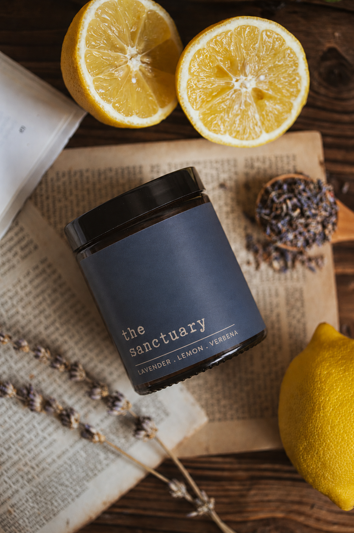 Soy candle by WILDOAK BOTANICALS featuring lavender, lemon, and ylang ylang essential oils, shown in a flat lay with a relaxing scent.