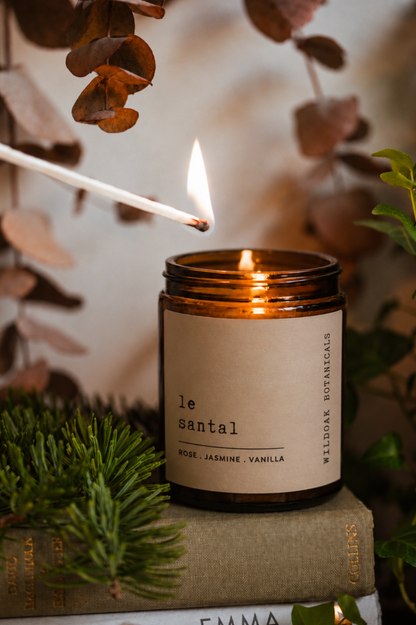 Soy candle by COSYPLACE CANDLES with Santal fragrance, featuring rose, jasmine, and amber label design.