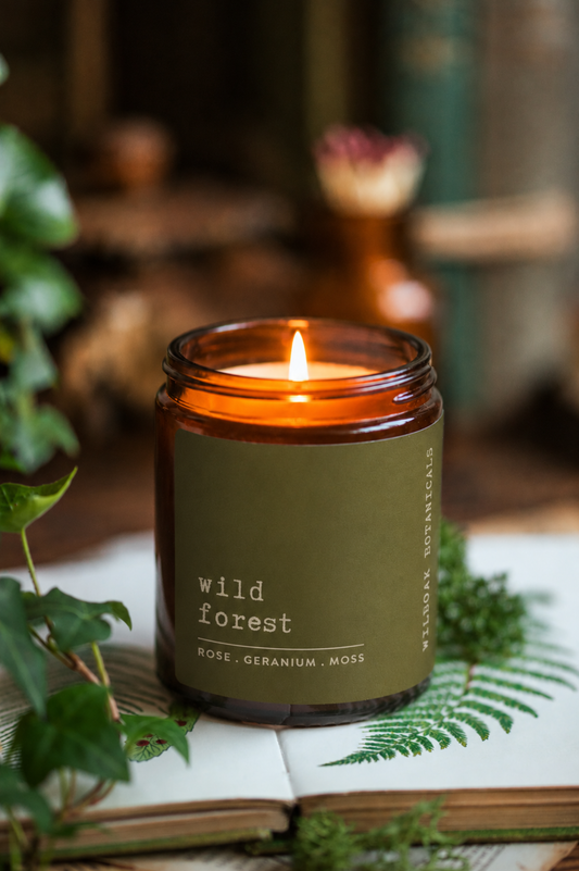 Soy candle from WILDOAK BOTANICALS in Wild Forest scent with rose, geranium, and jasmine floral accents.